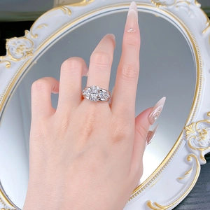 Detailed view of an oval-cut S925 silver ring worn on hand with sparkling gemstones