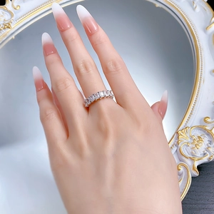 Detail of silver S925 ring featuring rectangular baguette-cut cubic zirconia in a row