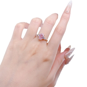 Classic S925 silver ring with oval pink gemstone and white side stones in rose gold