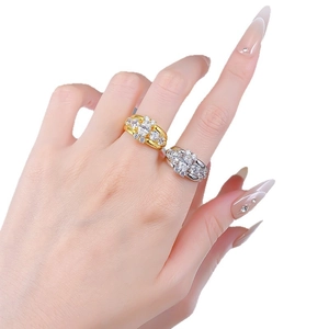 Luxurious S925 silver oval cubic zirconia rings in gold and silver finishes on a model hand