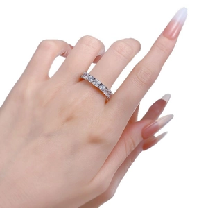 Minimalist square-cut zircon stackable ring in silver finish worn on model hand