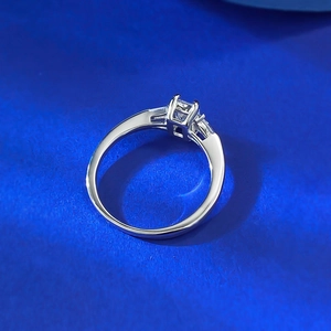 Minimalist S925 silver ring featuring a princess cut square solitaire stone on blue background