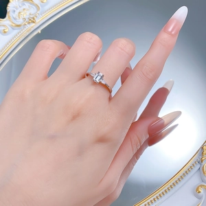 Close-up of S925 silver ring featuring emerald-cut clear stone and side trapezoid gems