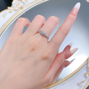 Macro shot of S925 silver ring with rectangular pavé zircon and textured band