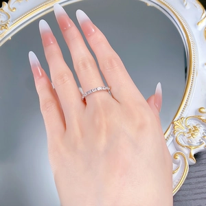 Close-up of minimalist S925 silver ring with rectangular stones on model's finger
