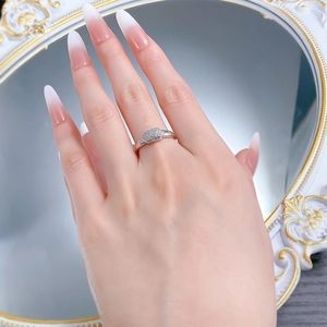 Detailed shot of an S925 silver rectangular diamond ring with ribbed texture worn by a model