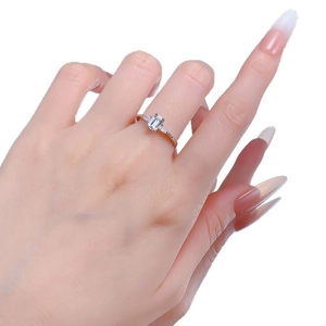Elegant S925 silver ring featuring rectangular emerald cut zircon and tapered side stones