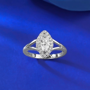 Elegant S925 silver ring with marquise-cut center stone and sparkling halo on blue velvet