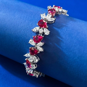 Luxurious S925 silver bracelet featuring pear-shaped red rubies and marquise-cut white gems