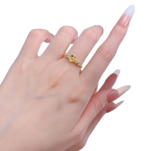 Elegant gold S925 silver plum blossom ring with diamond accents on a slender band