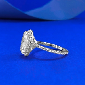 Elegant 925 sterling silver halo ring with large oval-cut center stone on blue background