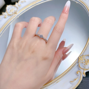 Close-up of S925 silver 5mm moissanite ring with twisted pavé band on a model