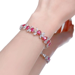 Elegant S925 silver bracelet featuring vine design with ruby red gems and white zircon