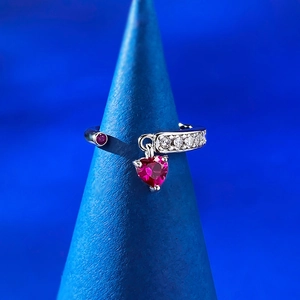 Detailed close-up of S925 silver open ring with heart-shaped pink gemstone and pavé accents