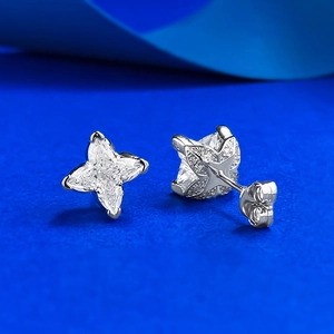 S925 sterling silver four-point star stud earrings with clear zircon on blue backdrop