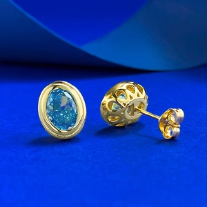 Elegant gold plated S925 silver stud earrings with oval ice-cut aquamarine stones