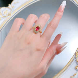 Luxury S925 silver ring with oval red zircon in a vintage court style on a mirror