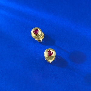 Elegant S925 sterling silver heart earrings with red gemstones and golden settings