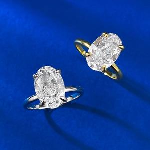 Eleganti anelli con pietra ovale 8x12mm in argento e oro e castone a quattro griffe