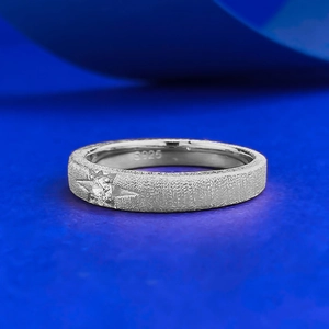 S925 sterling silver ring with brushed finish and single starburst moissanite