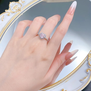 Detailed view of an S925 silver ring featuring a heart-shaped pink gem and side diamonds