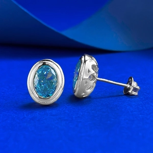 Elegant S925 silver gold-plated stud earrings with ice-cut blue aquamarine gemstones