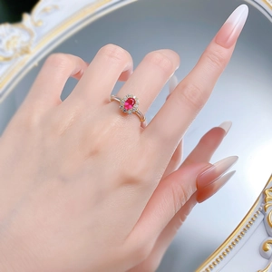 Elegant S925 silver flower ring with oval red ruby and white diamonds on female hand
