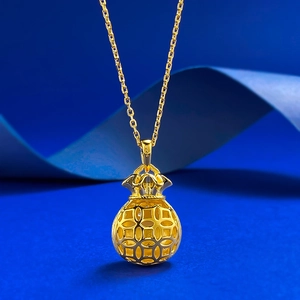 S925 sterling silver brushed gold lucky bag pendant necklace on a blue silk background