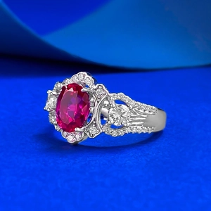 Luxurious S925 silver ring with large oval red gemstone and white diamond accents