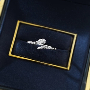 Detailed close-up of S925 silver ring with waterdrop zircon in a blue velvet box