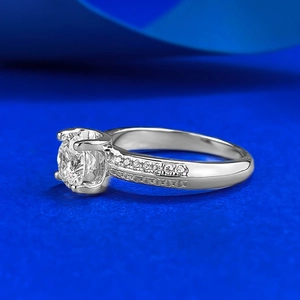 Classic S925 sterling silver four-prong ring with round brilliant cut diamond on silk background
