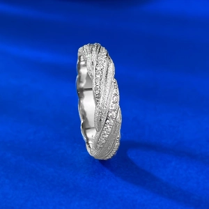 Macro shot of silver twisted ring featuring intricate pave micro-setting zircons