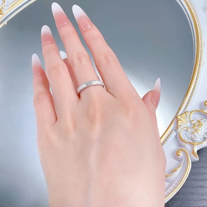 Macro view of brushed S925 sterling silver ring featuring a classic star-set zircon