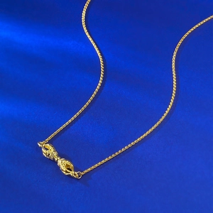 S925 silver gold-plated Vajra pendant necklace with intricate details on blue background