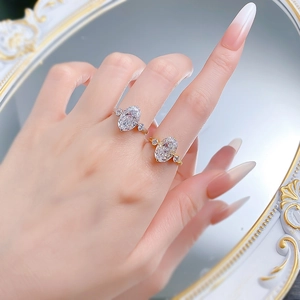 Close-up of S925 sterling silver rings with oval cut stones in gold and silver finishes