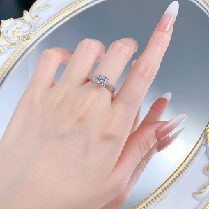 Detailed view of S925 sterling silver ring with classic round cut diamond and pavé band