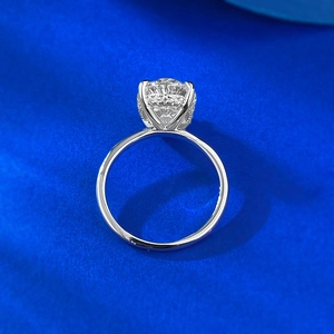 S925 sterling silver ring with 9x13mm round brilliant gemstone on royal blue background