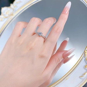 Detailed view of an S925 silver four-prong ring with a sparkling 6.5mm round cut stone