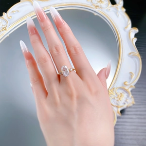 Close-up of gold-plated S925 silver ring featuring a large oval-cut ice flower diamond