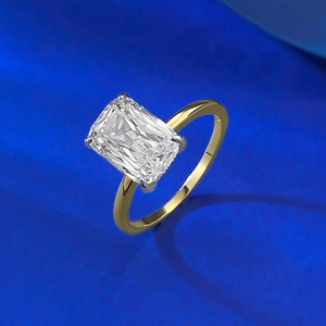 Detail of radiant cut rectangular stone in a gold plated four-prong silver ring setting
