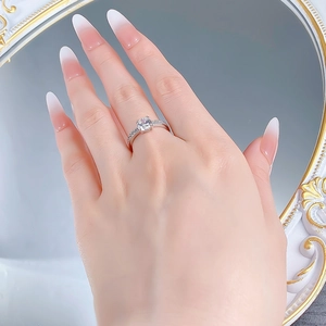 Detailed view of S925 silver four-prong solitaire ring with a 6.5mm round diamond