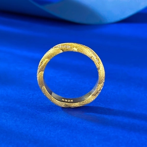 S925 sterling silver gold plated brushed ring with twisted zircon rows on blue silk