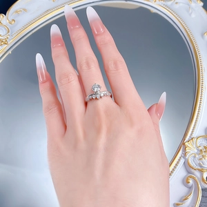 Close-up of S925 sterling silver V-shaped crown ring with sparkling pavé zircon stones
