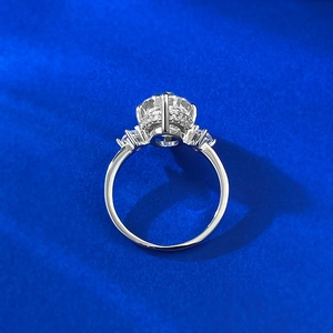 S925 sterling silver ring featuring a large oval ice-cut carbon diamond with side stones