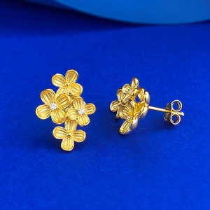 Luxurious S925 silver flower stud earrings with gold finish and sparkling zircon centers