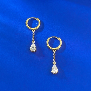 Elegant S925 silver gold-plated hoop earrings with pear-cut crystal drops on blue background