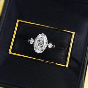 Macro 45-degree angle view of an oval-cut stone ring in a black velvet jewelry box