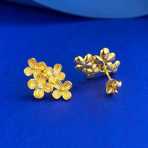Luxurious S925 silver flower stud earrings in gold finish with sparkling zircon centers