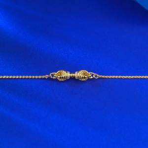 S925 silver gold Vajra bracelet featuring sparkling pave set zircon on blue silk background