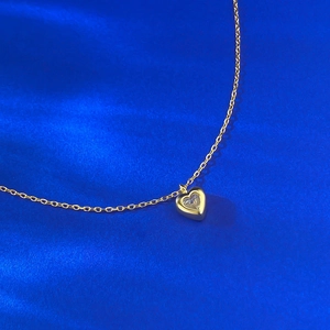 Elegant S925 silver 18K gold heart pendant necklace with shimmering heart-shaped zircon